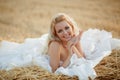 Bride in hay stack Royalty Free Stock Photo