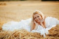 Bride in hay stack Royalty Free Stock Photo