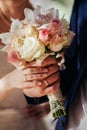 Bride hold wedding bouquet of rose peonies and roses Royalty Free Stock Photo