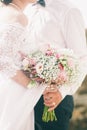 Bride hold wedding bouquet of rose peonies and roses Royalty Free Stock Photo