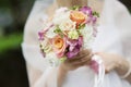 Bride holding beautiful pink wedding flowers