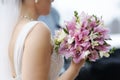 Bride holding beautiful wedding flowers bouquet