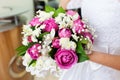 Bride holding beautiful wedding bouquet with pink roses Royalty Free Stock Photo