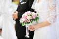 Bride holding beautiful wedding flowers bouquet