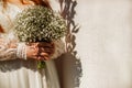 Bride holding beautiful wedding flowers bouquet on white background Royalty Free Stock Photo