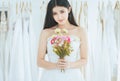 Bride holding a bouquet on hand for wedding,Beautiful asian woman smiling and happy,Romantic and sweet moment