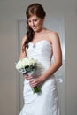 Bride holding bouquet and looking down Royalty Free Stock Photo