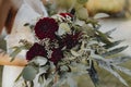 Bride holding a bouquet of red dahlia flowers Royalty Free Stock Photo