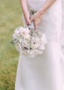 Bride holding bouquet white flowers hands down Royalty Free Stock Photo