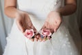 Bride holding the bridesmaid's flowers