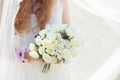 Bride holding a bunch of white roses Royalty Free Stock Photo
