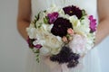 Bride Holding a Colorful Wedding Flower Bouquet of White Hydrangea, Peonies and Roses Royalty Free Stock Photo