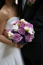 Bride holding her bouquet with groom