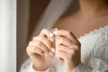 The bride is holding her engagement ring in her hands. Royalty Free Stock Photo