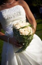 Bride holding rose bouquet