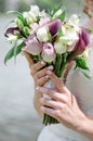 The bride holding soft wedding bouquet of roses, nice wedding bouquet in bride`s hand Royalty Free Stock Photo