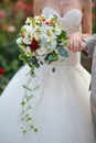 Bride holding wedding bouquet of colorful flowers and roses Royalty Free Stock Photo