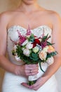 Bride holding a wedding bouquet of pink roses. Royalty Free Stock Photo