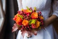 Bride holding wedding Colorful bouquet of autumn flowers Royalty Free Stock Photo