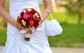 Bride holding wedding flowers