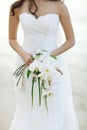 Bride holding white orchid flower wedding bouquet Royalty Free Stock Photo