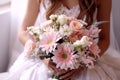 bride holds a beautiful wedding bouquet of pink and white flowers Royalty Free Stock Photo