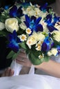 Bride holds a wedding bouquet