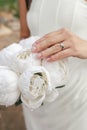 The bride holds a wedding bouquet of white peonies close-up Royalty Free Stock Photo