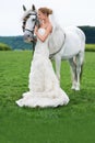 Bride, horse and field with wedding, event and animal for marriage, celebration and happiness. Woman, uk countryside and Royalty Free Stock Photo