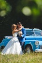 Bride Hugging Groom with Bouquet Royalty Free Stock Photo