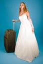 Bride with large suitcase Royalty Free Stock Photo