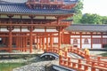 Bride leading to the Phoenix Pavilion of the Byodoin Temple in Kyoto Royalty Free Stock Photo