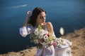 Bride in lingerie. Holds the Bridal bouquet . Charges of the bride, bride`s morning. Royalty Free Stock Photo