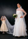 Bride with little bridesmaid Royalty Free Stock Photo