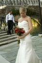 Bride Looking at Flowers with Groom Royalty Free Stock Photo