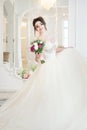 Bride in luxury interior in palace. Wedding, attractive brunette Royalty Free Stock Photo