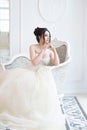 Bride in luxury interior in palace. Wedding, attractive brunette Royalty Free Stock Photo