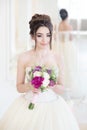 Bride in luxury interior in palace. Wedding, attractive brunette Royalty Free Stock Photo