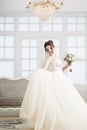 Bride in luxury interior in palace. Wedding, attractive brunette Royalty Free Stock Photo