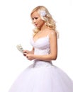 Bride with money. holding and counting dollars bills. beautiful blonde young woman isolated