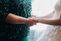 Bride with mother wedding hand