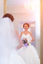 Bride next to mirror