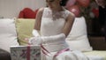 Bride opening wedding gift.