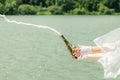 the bride opens a bottle of champagne with splashes. Close-up Royalty Free Stock Photo