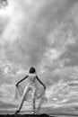 Bride with orange hair on blue sky