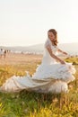 Bride playing with messy dress