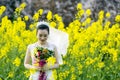 Bride portraint with white wedding dress in cole flower field