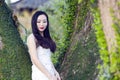 Bride portraint with white wedding dress in front of Old trees and old building