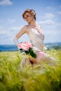 Bride posing in field Royalty Free Stock Photo