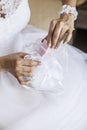 Bride pulls out a purse box with wedding rings or a gift from th